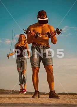 Sportsman with dumbbells. Sportsman wear vr headset for training. Sportsman with Stock Photos