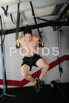 The sportsman the guy, carries out difficult exercise, sports gymnastics. ri Stock Photos