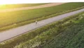 The sportsman jogging on the road. quadrocopter shot 4k or 4k+ Resolution