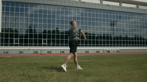 Sportsman with Limb Difference Throwing Javelin at Athletics Field Video stock 297945649