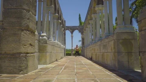 Sportsman makes a sequence of exercises with flips and pushups Stock Footage 112696290