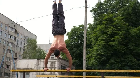 Sportsman performing dynamic workout routine, transitioning from push-up Stock Footage 321053949