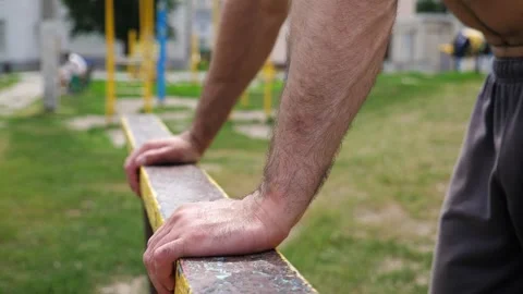 Sportsman performing intense workout on parallel bars, showcasing strength Stock-Footage 317233919