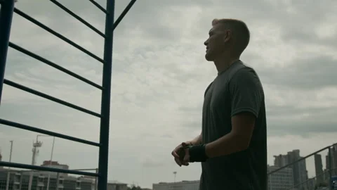 Sportsman with Prosthetic Hook Performing Pull-Ups at Stadium Video stock 297955186