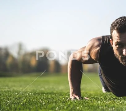 The sportsman pushing up on the grass Stock Photos