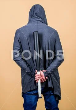 Sportsman strong looks threatening with bat. Aggression masculinity strong Stock Photos