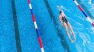 Sportsman In A Swimming Pool Swims Away. Top View. Stock Footage