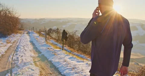 Sportsman talking on his mobile phone - slow motion Stock Footage