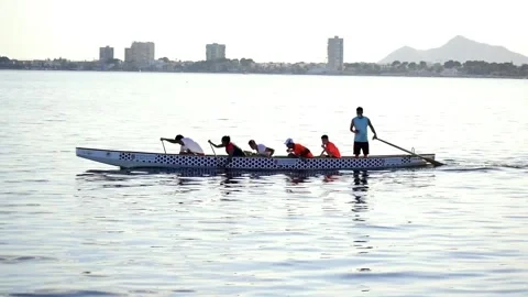 Sportsmen rowing in team at same pace at the sea. 動画素材 132997132