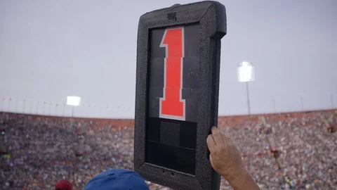 Sportsperson showing down indicator box with number one during the NFL match Stock Footage 113274716