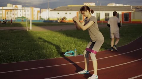 Sportswoman doing squats Stock Footage 135225559