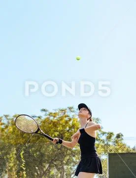 Sportswoman playing tennis on court Stock Photos