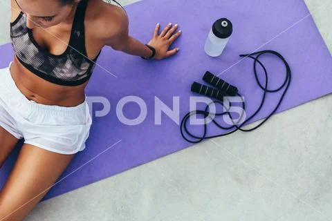 Sportswoman resting after physical training Stock Photos