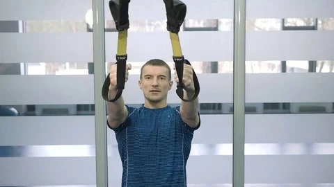 Sporty man doing exercise at the gym Stock Footage 71813292