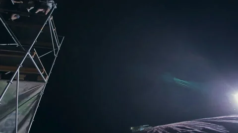 Sporty Man Performing Flips From a Tower on the Big Air Cushion. Extreme Stock Footage 60704553