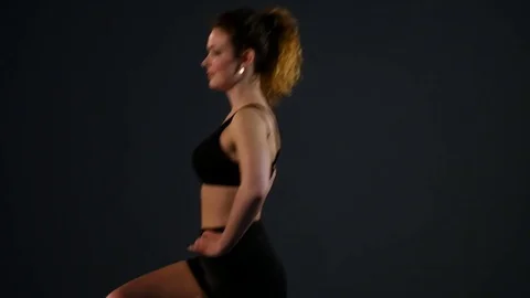 Sporty woman doing stretching exercises outdoor. Fitness girl doing lunges in Stock Footage