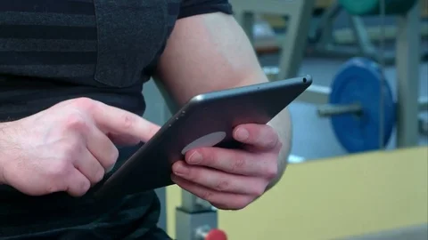 Sporty young man using a digital tablet in the gym Stock Footage 73918515