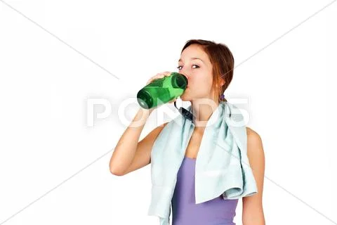Sporty young woman drinking water Stock Photos