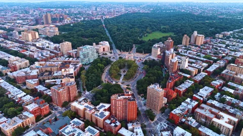 Spot of gorgeous lush greenery in the cement jungle of metropolis. Flight over Stock Footage 346610179