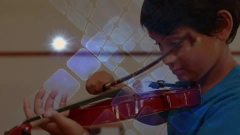 Spot of light and square shapes against close up of caucasian boy playing a Stock Footage 330290690