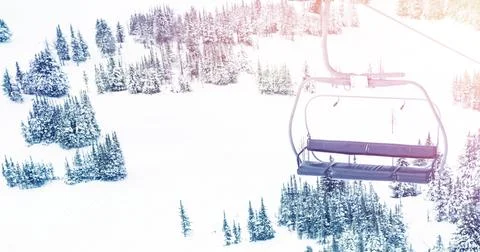 Spot of light over cable car and trees on winter landscape Illustrazione stock