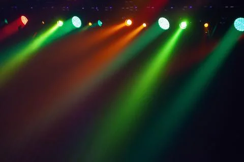 Spot lights over dark background, rock music concert stage illumination Stock Photos