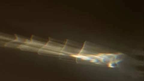 Spot of reflected light flickers on a gray surface. Stock Footage 153138669