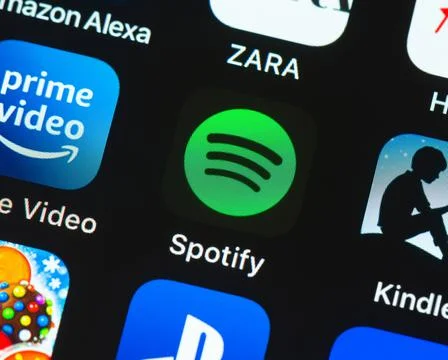 Spotify app icon on Apple iPhone screen Stockfoto's