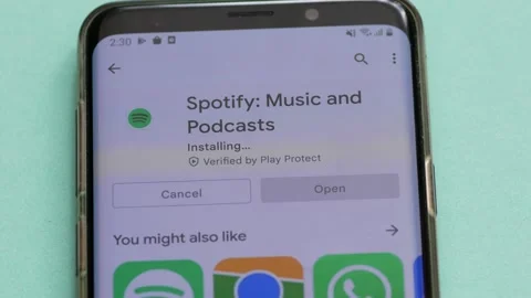 Spotify mobile application is installed on a smartphone. Spotify program icon on Stock Footage 171936784