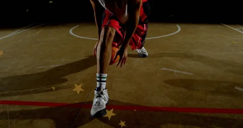 Spotlight activating basketball player executing crossover with stars chasing Video stock 314718265