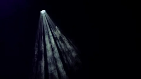 Spotlight beam cutting through smoke creating dramatic rays for stage Stock Footage 330008307