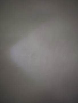 Spotlight Beam Projected on Dark Grey Textured Wall Surface Stock Photos