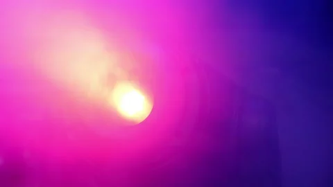 The spotlight glows red in the fog. Stock Footage 165433342