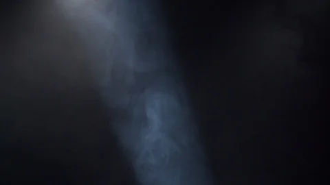 Spotlight highlightens the flow of dust and fog Video stock 129639899