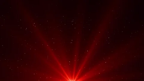 A spotlight illuminates the background of the stage with red beams of light. Stock Footage 272771330