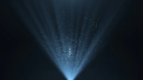 A spotlight illuminates the background of the stage. Spotlight with flying sh Stock Footage 298020370