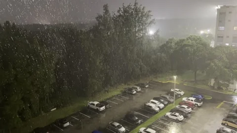 Spotlight-Lit Raindrops During Hurricane, Parking Lot, 4K Vídeos de archivo 340176396