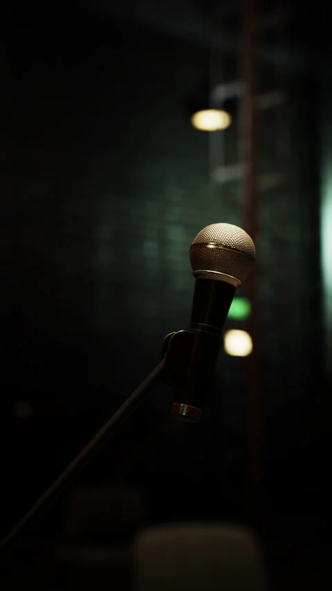 Spotlight on the microphone before an intimate opera performance at dusk Stock Footage 326203034