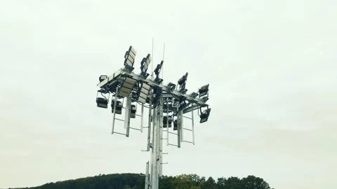 Spotlight of modern stadium lighting. Flight around the spotlight Stock Footage 139208716