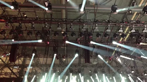 Spotlight performance with moving light beans and changing the light color Stock Footage 86984535