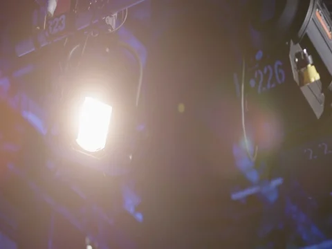 Spotlight in a professionel television studio lights up Stock Footage 75011387