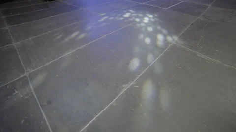 Spotlight reflections scatter across cold venue floor during test Stock Footage 327123846