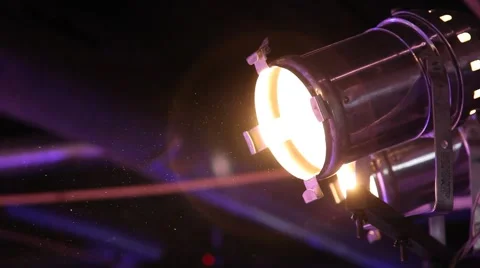 Spotlight shines in the studio, glow dust Stock Footage 44810077