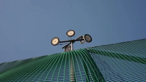Spotlight, Stadium lights, with blue sky timelapse 4k Stock Footage 302309432