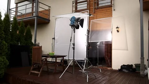 Spotlight on stand outside the house Stock Footage 238003354