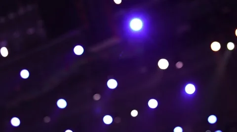 Spotlight strike through the darkness on stage. Stage lights. Several projectors Stock-Footage 65227393