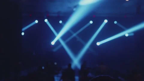 Spotlights and lights on the scene during the music show with the audience. Stock Footage 145125574