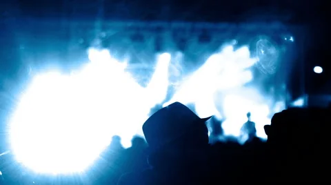 Spotlights over a concert stage - crowd is in the shadow. Monochrome blue scene. Stock Footage