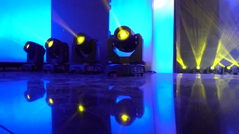 Spotlights shine with multi-colored rays from the stage. theater stage Stock Footage 143737657