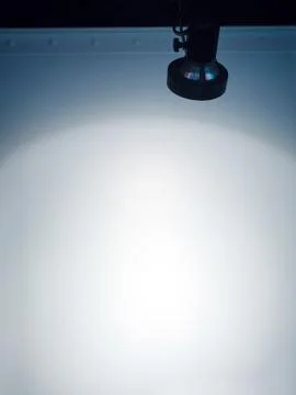 Spotlights on the white wall Stock Photos